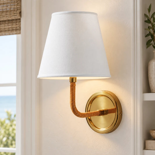 Elodie Rattan Wrapped Single Wall Sconce, Brass / White Taper installed SKU image
