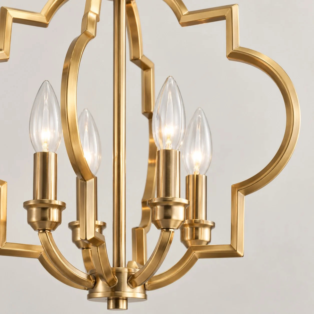 Gold Fable candle sockets and geometric metal frame close-up