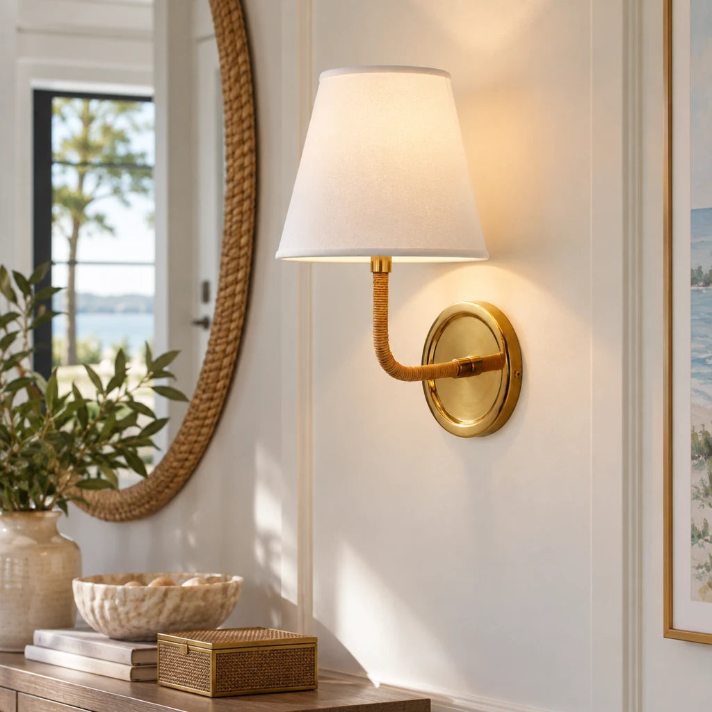 Elodie Rattan Wrapped Single Wall Sconce, Brass / White Taper installed close view