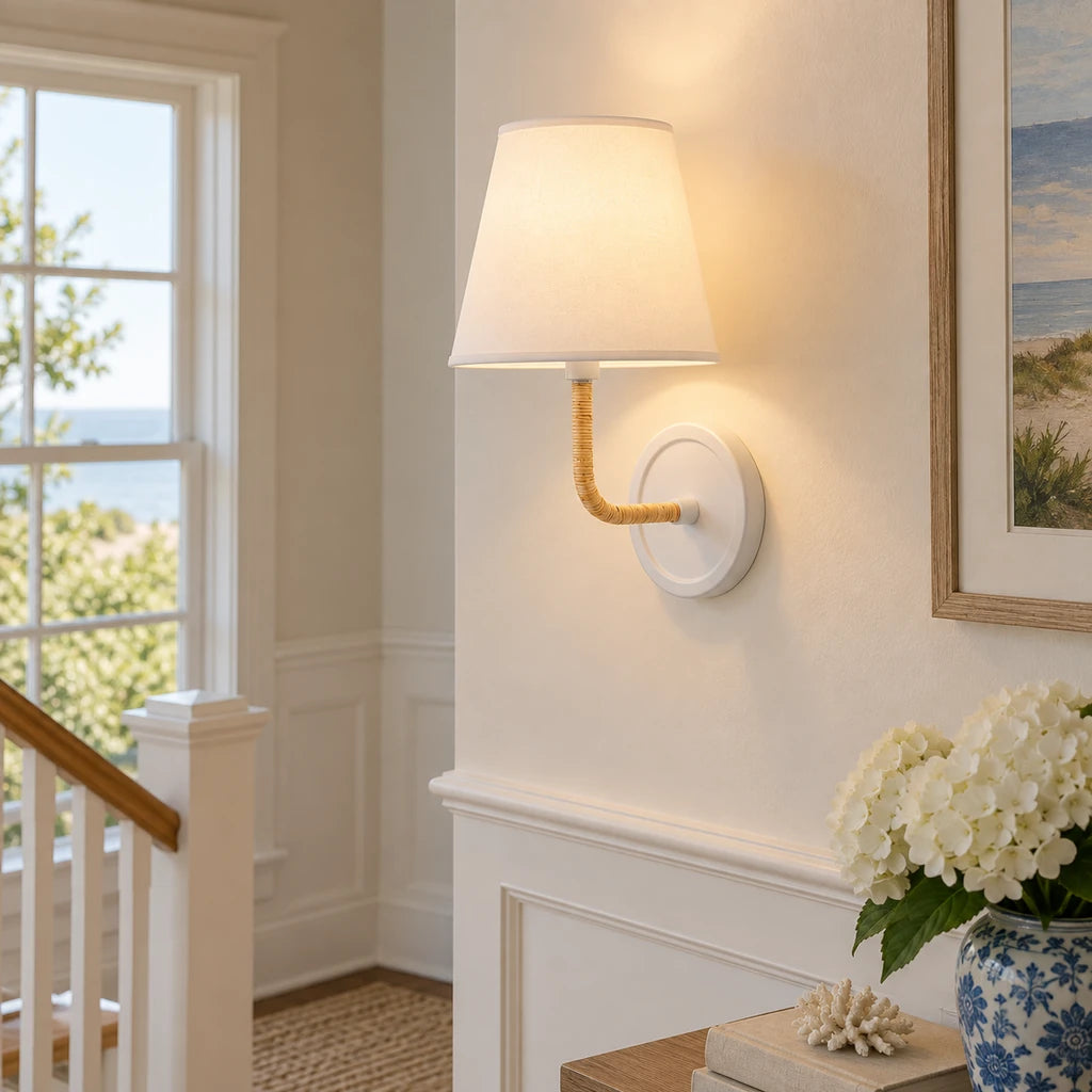 Elodie Rattan Wrapped Single Wall Sconce, White / White Taper installed close view