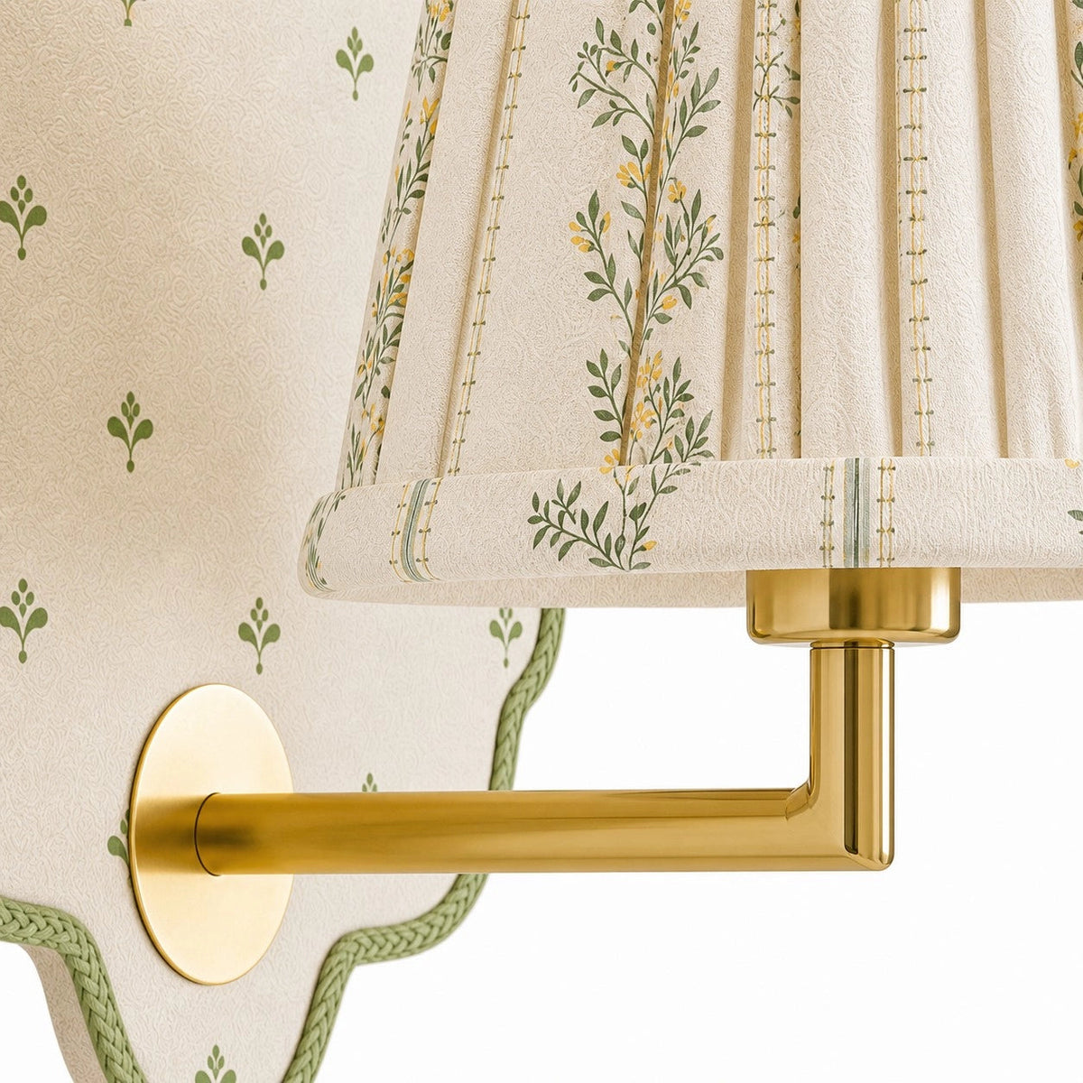 Maribel Vintage Floral Fabric Wall Sconce, close detail of the gold-tone arm and green-trimmed patterned backplate