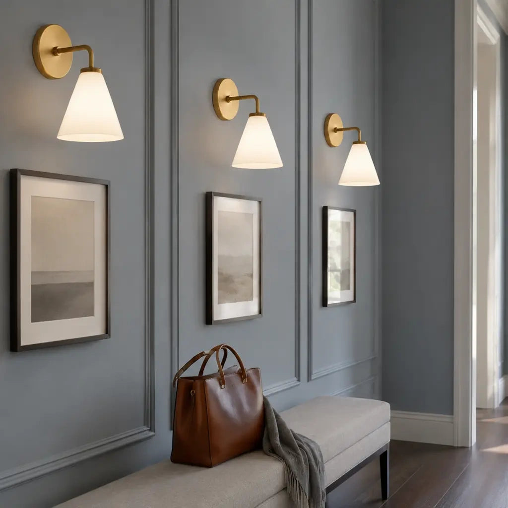Zorya industrial brass cone shade wall sconce, Milk Glass, installed room view