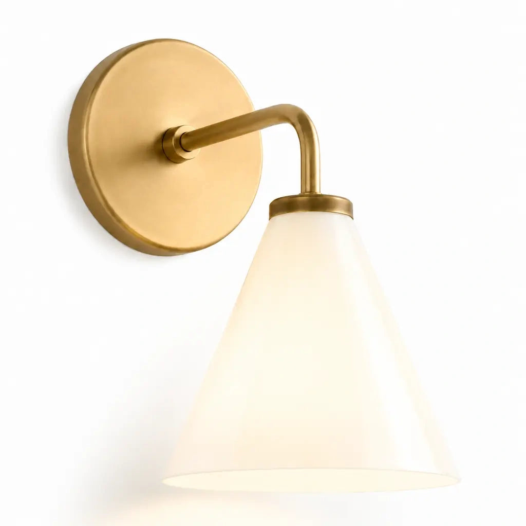 Zorya industrial brass cone shade wall sconce, Milk Glass, switched-on studio view