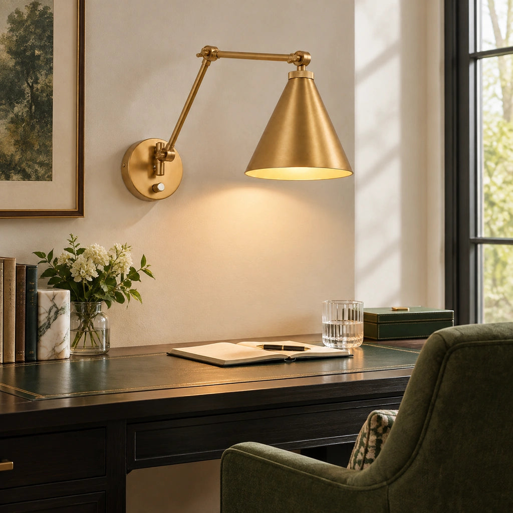 Zorya Industrial Metal Swing Arm Wall Sconce, illuminated above a writing desk